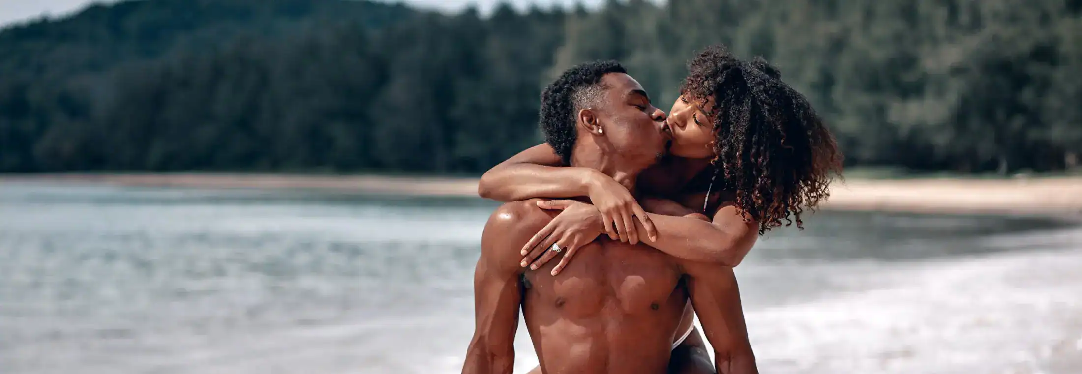 Loving couple embracing at the beach