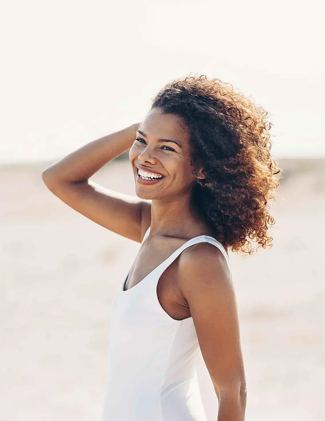 Smiling woman with curly hair