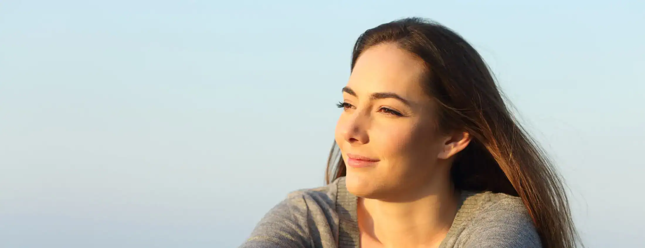 Calm woman enjoying peaceful ocean view