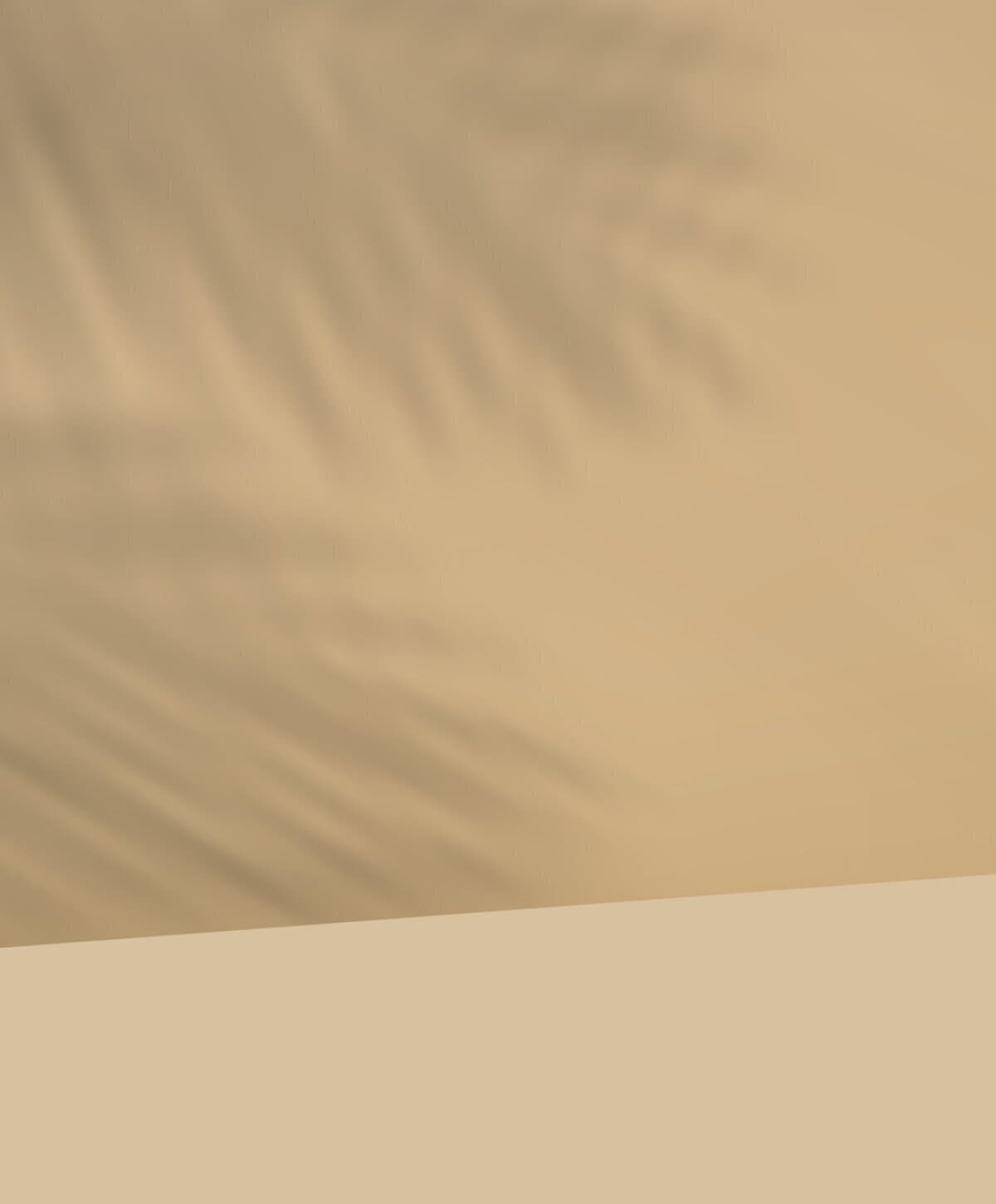 Minimalist aesthetic background featuring soft palm leaf shadows on a neutral beige wall, ideal for skincare branding.