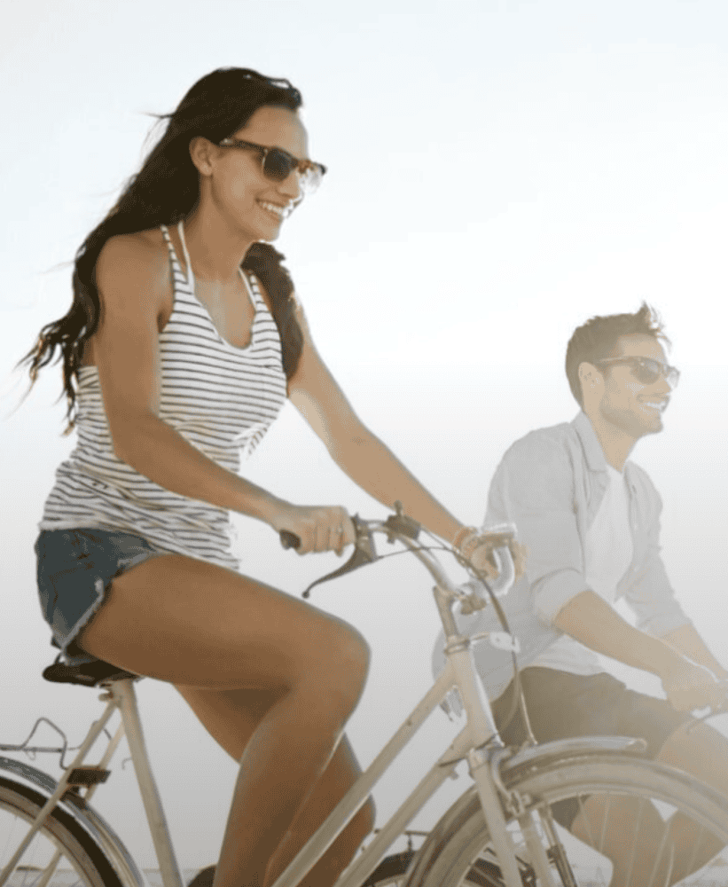 Couple cycling outdoors