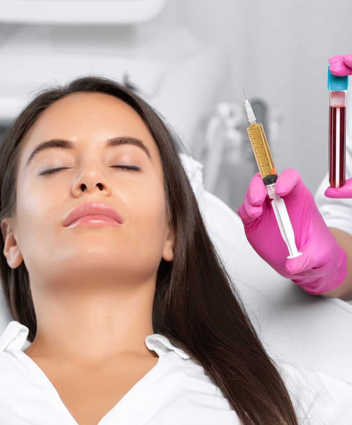 A woman receiving a medical facial treatment with a syringe and blood vial shown in the foreground.