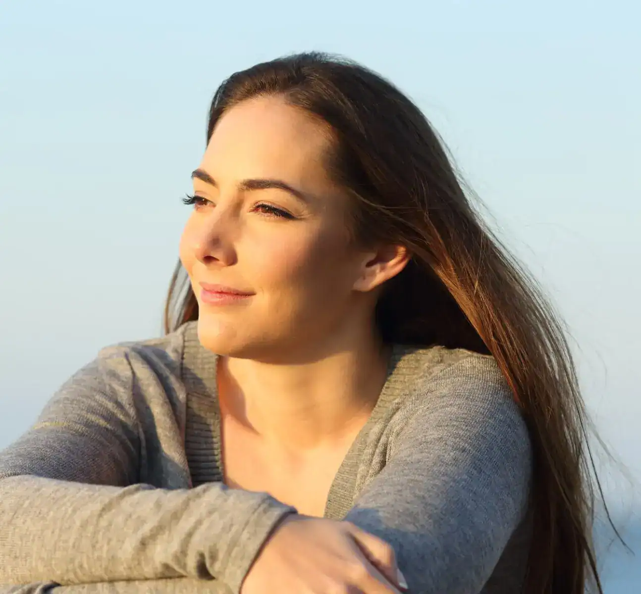 Calm woman enjoying peaceful ocean view